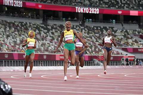 Elaine Thompson-Herah of Jamaica wins the 100-meter dash.