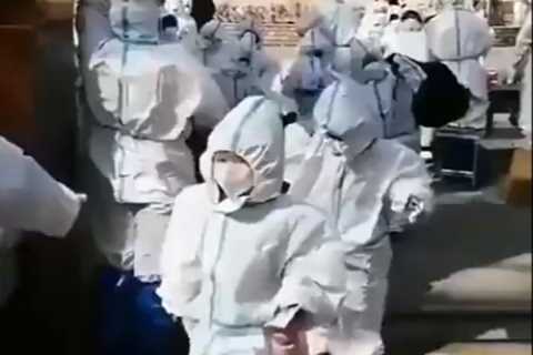 Unsettling footage shows children in Shanghai wearing HAZMAT SUITS on way to school amid bonkers..