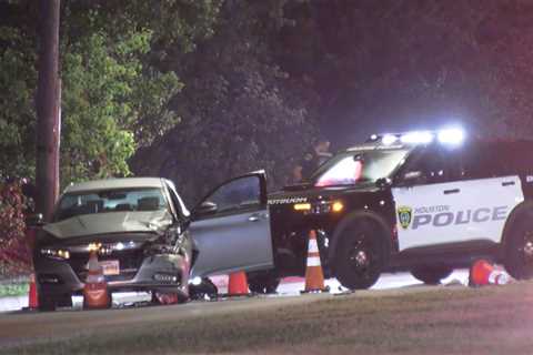 Two Houston police officers hurt in crash while blocking traffic