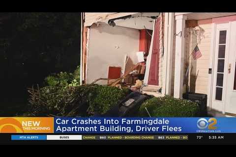 Car slams into LI apartment building