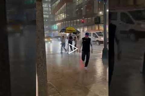 Man Pays Hot Dog Stand to use their Umbrella in Rainstorm