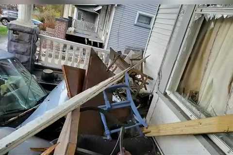 Truck plows through porch of Cleveland home