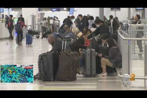 Frustrated faces make their way through LaGuardia Airport