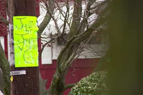 Akron, Ohio, police officers removed Jayland Walker signs