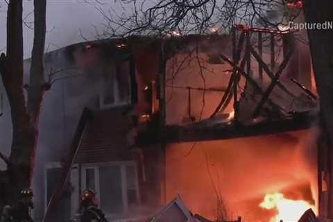 Neighbors hear blast before fire rips through Maine Township townhomes