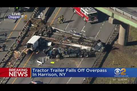 1 dead after tractor-trailer drives off overpass