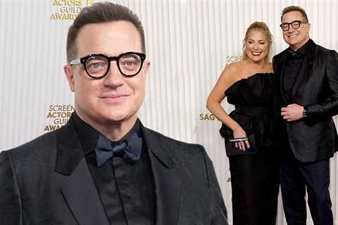 Brendan Fraser sleek in all-black ensemble as he walks red carpet with partner at SAG Awards