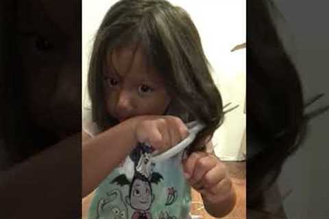 Adorable five year old caught cutting her own hair