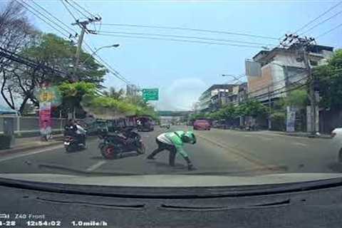 Delivery rider stops in middle of traffic to pick up lost kitten