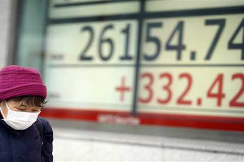 Asian shares mixed as China says economy slowed further