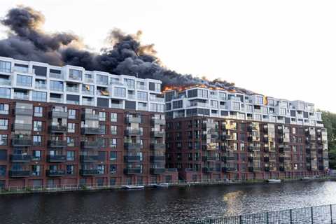 Huge fire engulfs apartment block in Brit tourist hotspot as massive black smoke cloud fills sky