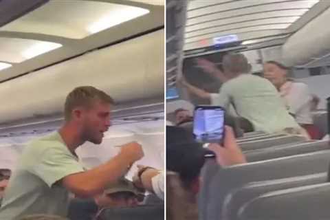 Shocking moment crazed ‘British boxer’ tries to open plane door during take off before being..