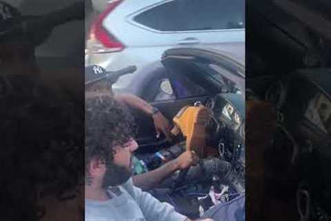 Guy replaces car steering wheel with Timberland boot