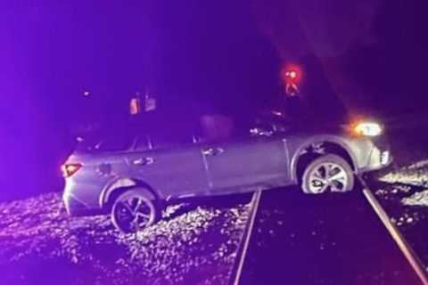 Dangerous midnight crash: Indiana driver stranded on train tracks faces serious charges