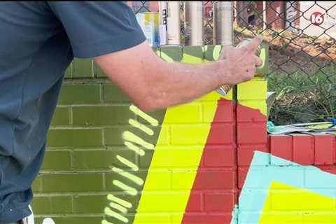 Artist paints mural in Fondren