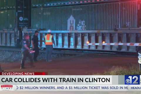 Two injured after car collides with train in Clinton