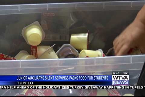 Junior Auxiliary in Tupelo packs food for students