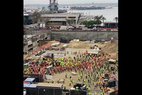 Huge gathering of construction workers stretch