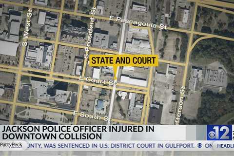 Jackson police officer, driver injured in crash