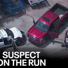 Dallas police shoot armed suspect after stolen truck rams cruisers; another suspect on the run