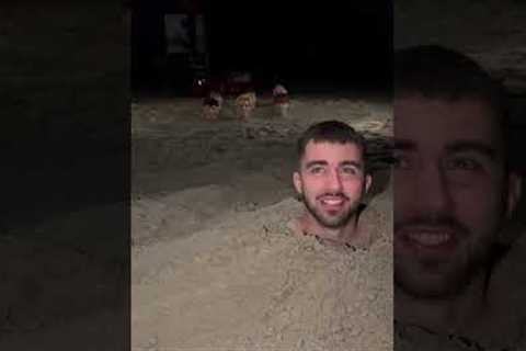 Group bury themselves in sand and sing 'SpongeBob' in Milano Marittima, Italy